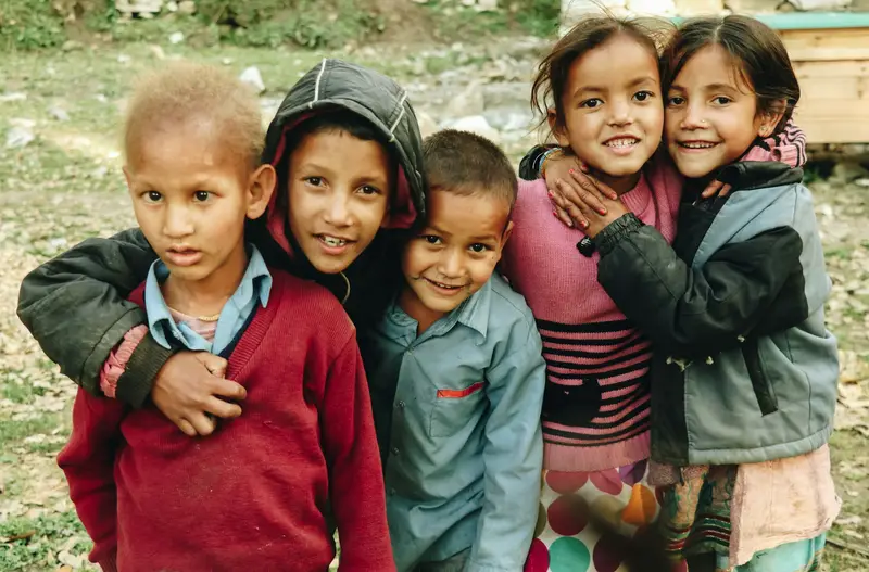 A group of Nepali children with their arms around each other