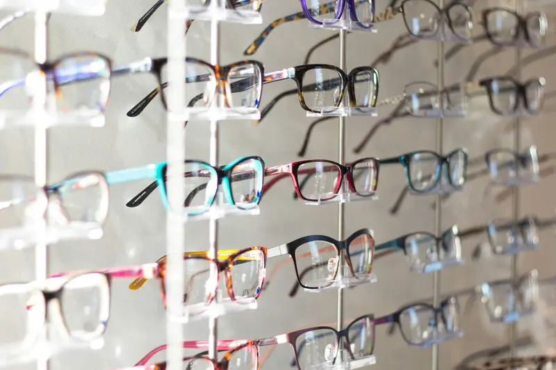 A wall of eyeglass frames in many colours